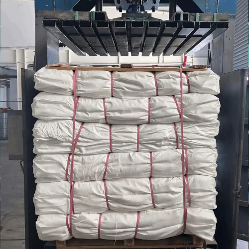 Woven bags stacked on pallets and wrapped for transport